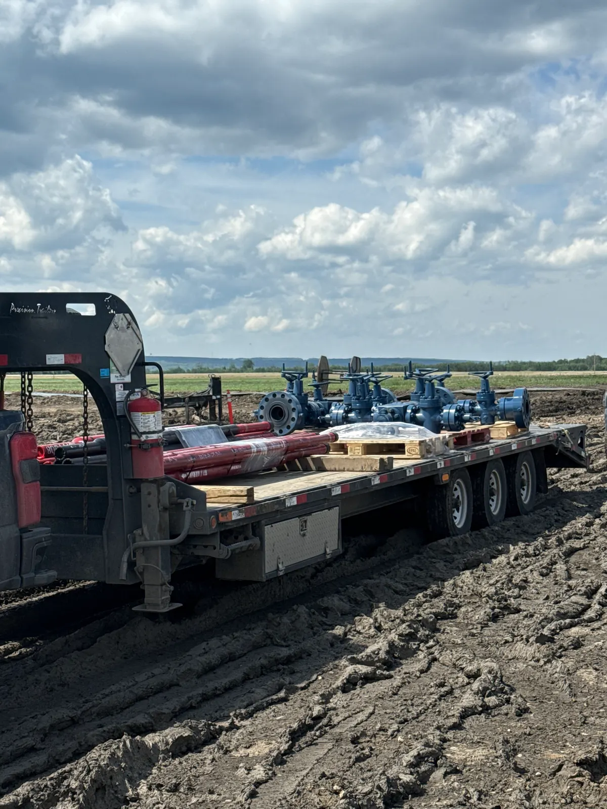 Pipe racks and catwalk loaded on a Nash Services trailer